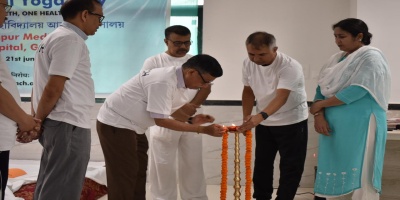 Senior Professors lighting the lamp.